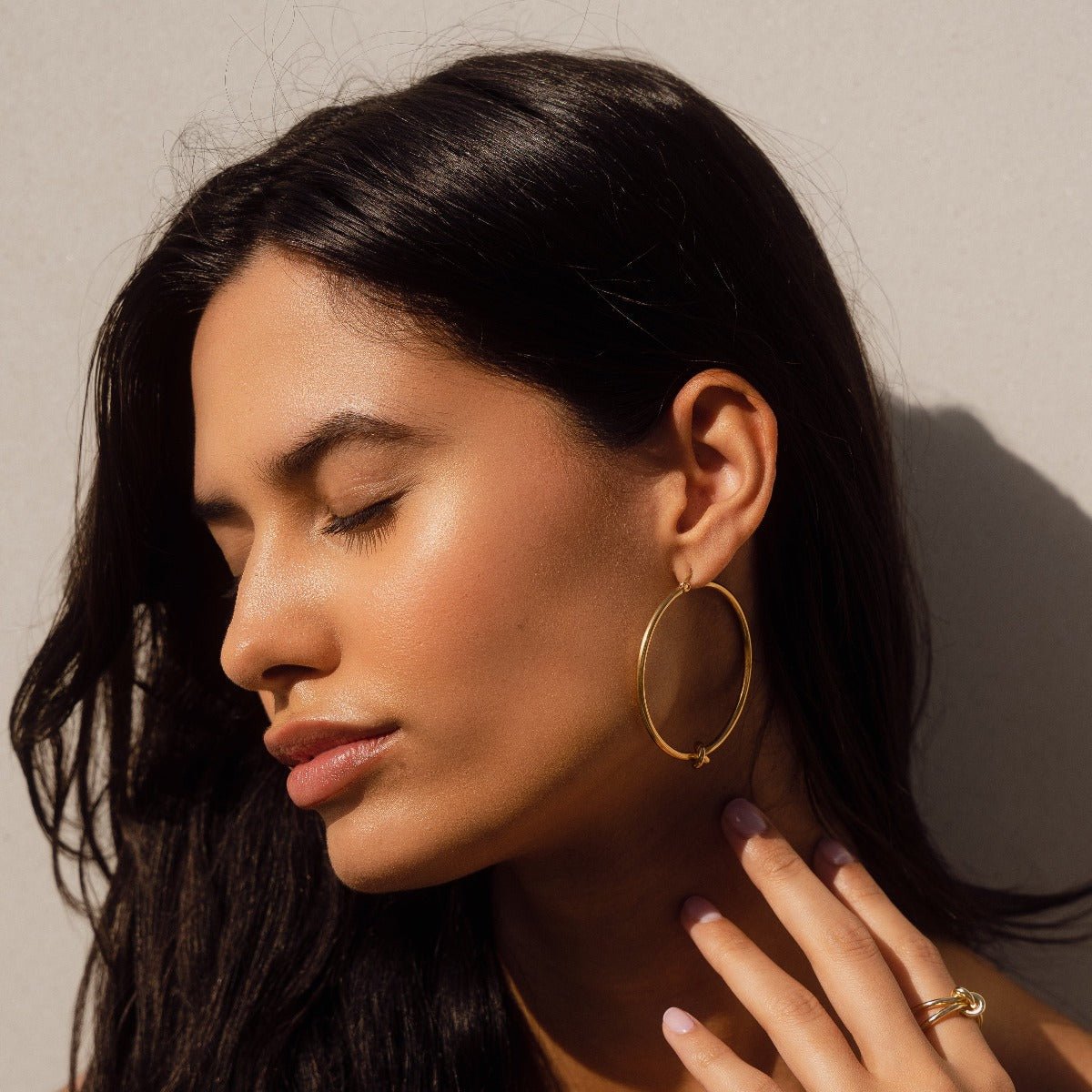 Brinco Nó de Ouro 18K